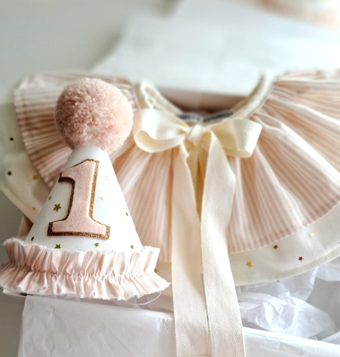 Vintage-inspired pink birthday hat and cape set, perfect for keepsake gifting