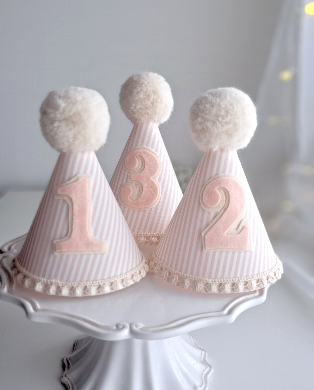 Strawberries and cream, pink and white pinstripe fabric  party hat. Ideal for birthdays, photography shoots and special occasions. Add a number for an extra special treat. 