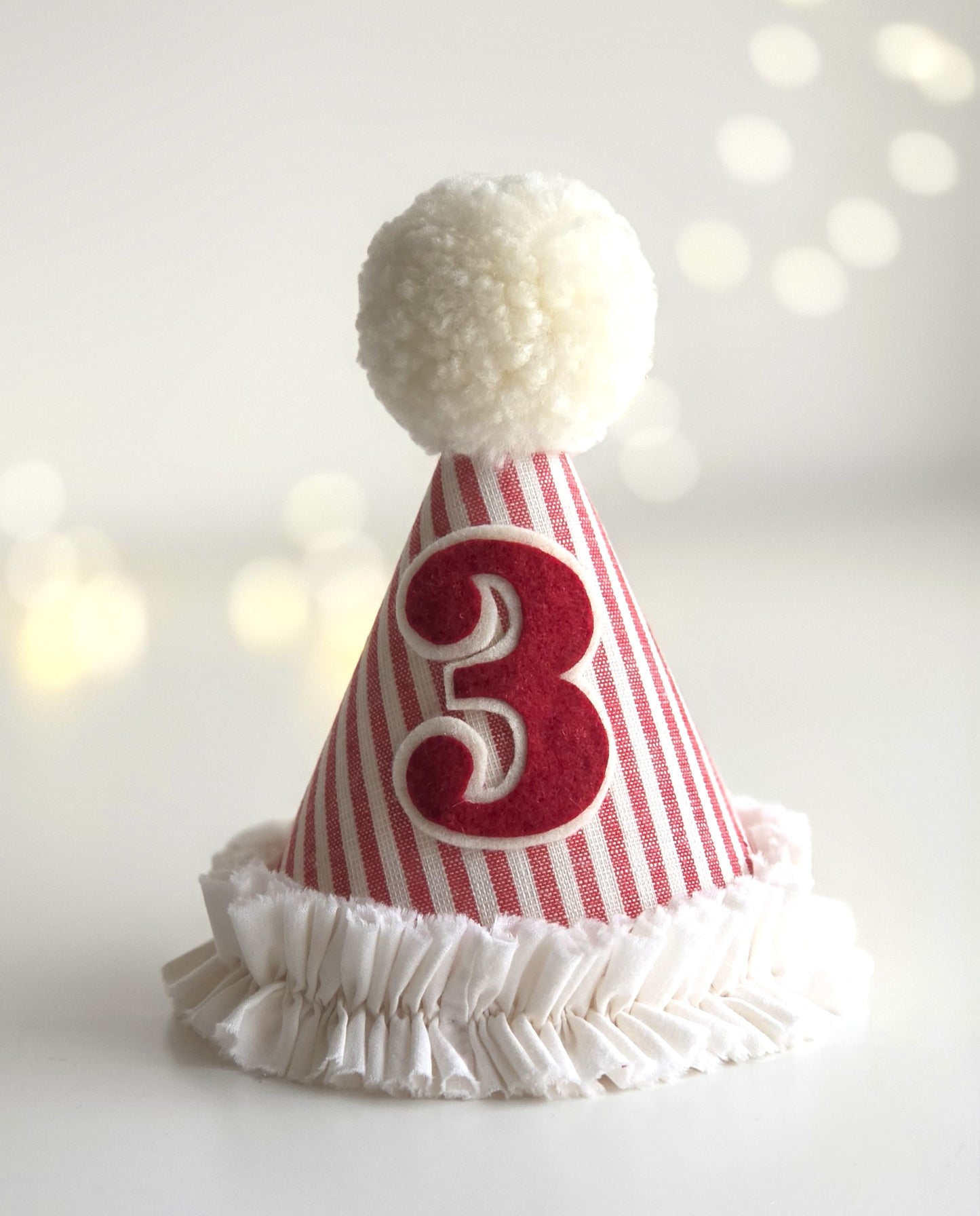 Red and white striped handmade girls circus party hat with number 3 and soft ruffle trim