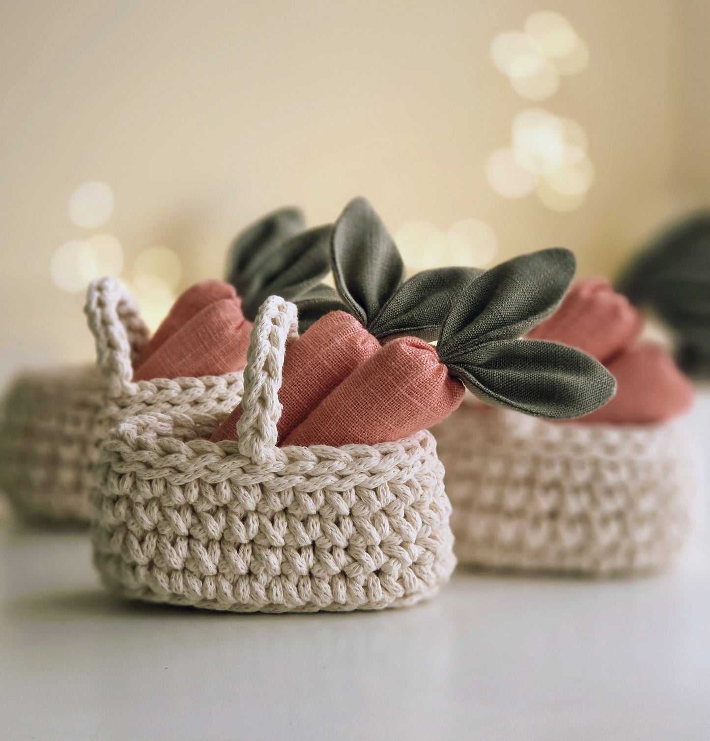 Hand-crocheted basket filled with soft linen carrots, spring toy accessory in warm natural tones