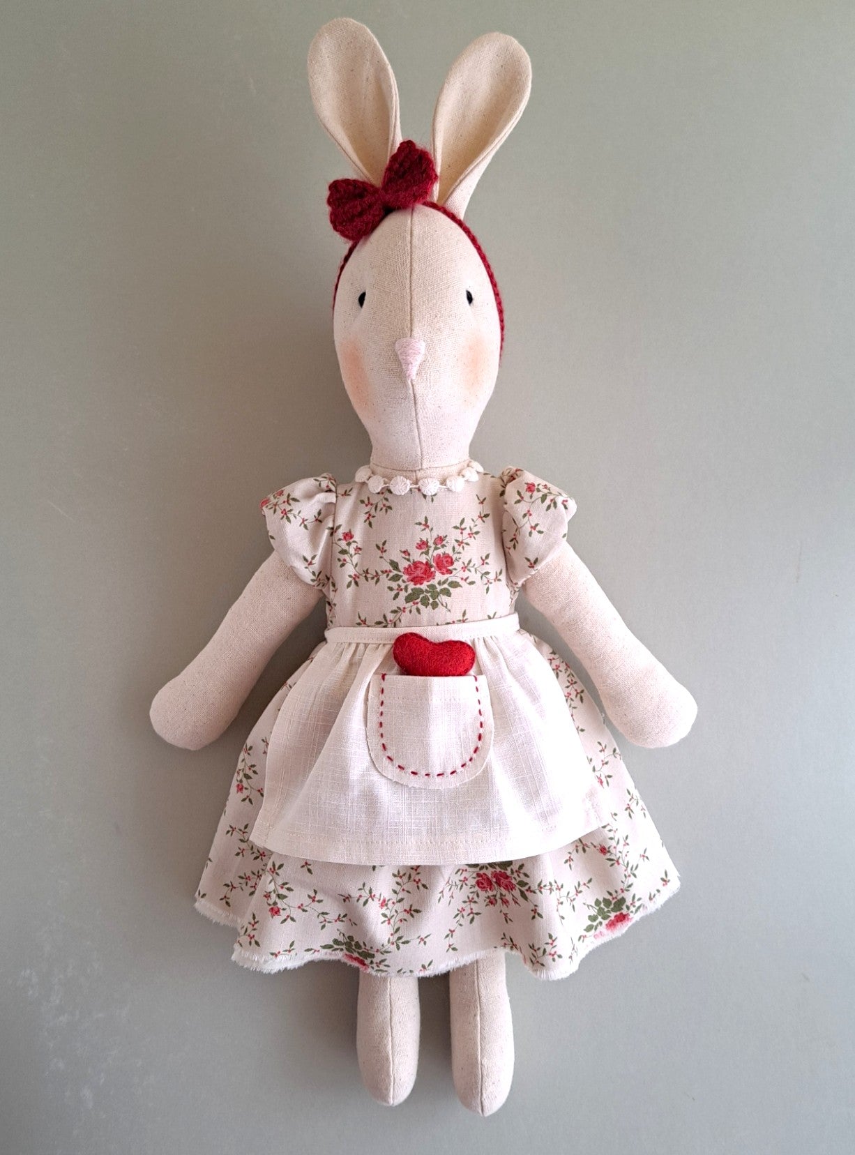 Veronica Bunny handmade from natural linen, dressed in a vintage rose floral cotton dress with a linen apron and hand stitched heart pocket