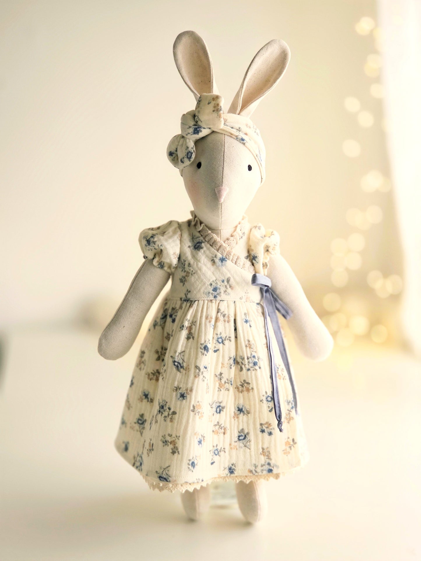 Handmade Veronica Bunny in blue ditsy floral wrap dress with silk ribbon tie, heirloom soft toy