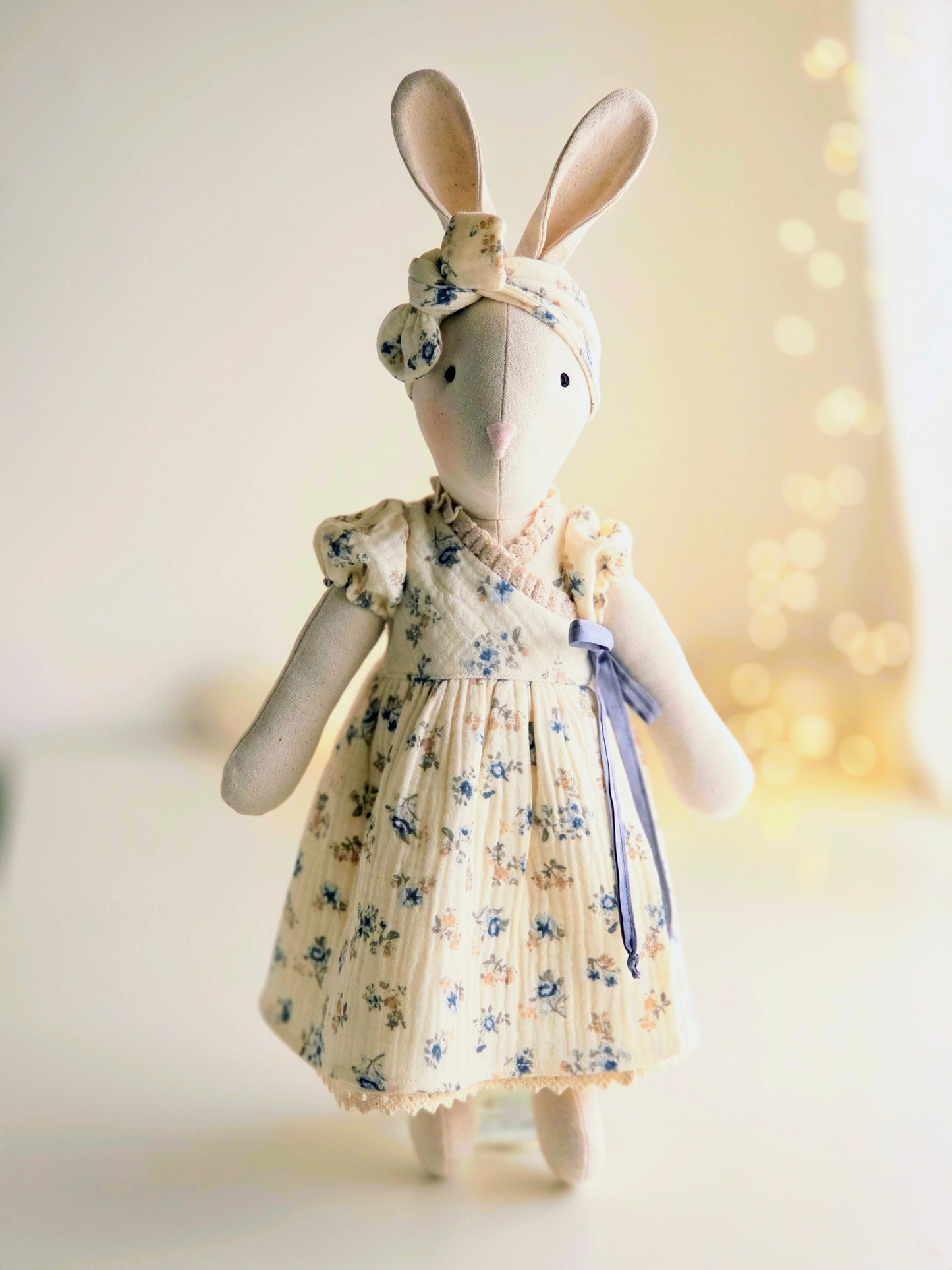 Handmade Veronica Bunny in blue ditsy floral wrap dress with silk ribbon tie, heirloom soft toy